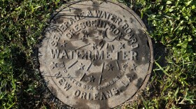 ADVANCE FOR SATURDAY, SEPT. 26, AND THEREAFTER - This Sunday, Jan. 20, 2015, photo, shows a water meter cover in New Orleans. Water rates have been shooting up nationwide in drought-stricken states and in cities trying to upgrade their aging infrastructure. Experts say the trend is sure to accelerate as the cost of water, treatment and delivery comes into line with how essential it is to our daily lives. (AP Photo/Jonathan Bachman)