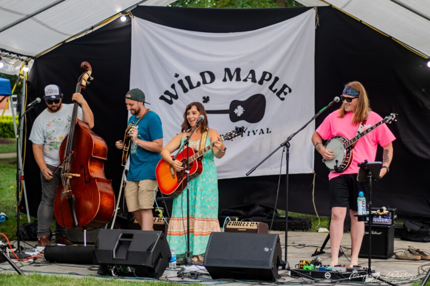 Guitarist and singer Lea Marra performs with her band on stage at the Wild Maple Festival