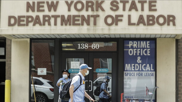 Pedestrians pass the New York State Department of Labor office.