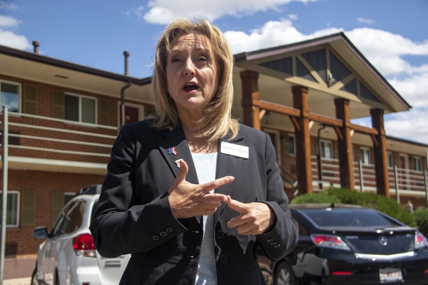 Activist and former U.S. House candidate Rebecca Keltie stands on May 31 outside of a Colorado Springs apartment building where she went looking for irregularities in the 2020 election.