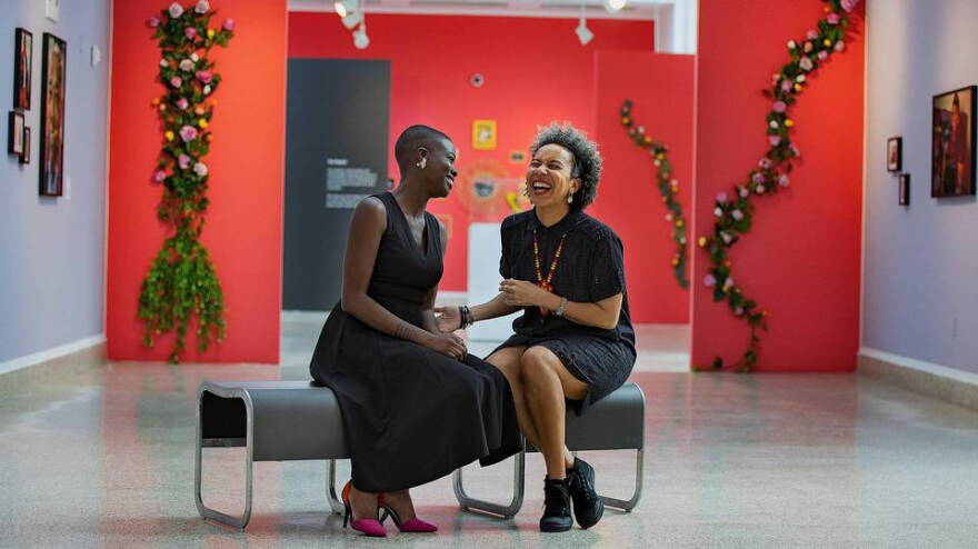 Curators Nadege Green (left) and Marie Vickles, of the exhibit “Give Them Their Flowers:” An Exhibit of Black LGBTQ+ Miami History “ at the Gallery at the Little Haiti Cultural Center.
