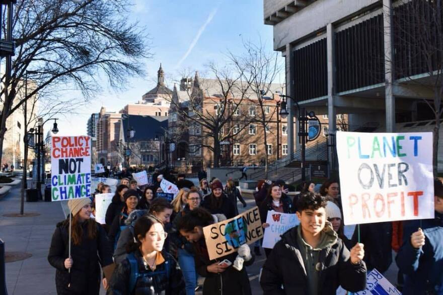 Students on the UW-Madison campus march to encourage action on climate change.