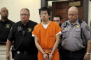 Tailei Qi, the graduate student suspected in the fatal shooting of a University of North Carolina at Chapel Hill faculty member, center, makes his first appearance at the Orange County Courthouse in Hillsborough, N.C., Tuesday, Aug. 29, 2023. Qi has been charged by the UNC Police Department with first-degree murder and possession of a weapon on educational property, both felony charges.