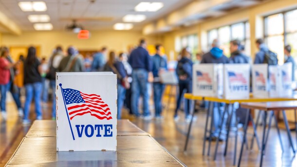 Vote booth at a busy polling station, USA Election Day, wide, copyspace, blurred background