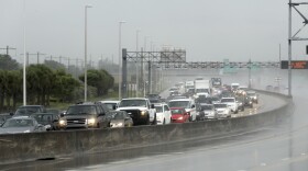 Northbound traffic on the turnpike near Sunrise Boulevard sits in the rain Thursday in Sunrise, Florida, ahead of Hurricane Irma. Irma cut a path of devastation across the northern Caribbean, destroying buildings and uprooting trees on a track that could lead to a catastrophic strike on Florida. (Mike Stocker/South Florida Sun-Sentinel via AP)