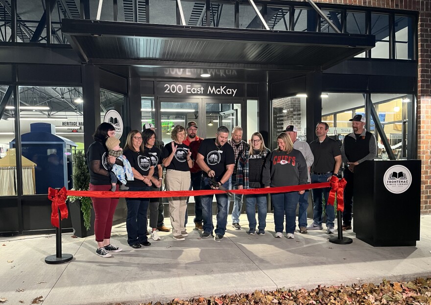 Frontenac Public Library Director Seth Nutt cuts the ribbon at the library's opening on Nov. 11.