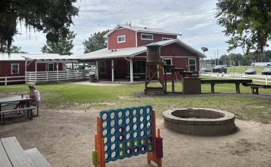 The Canyons Zip Line and Adventure Park offers a serene waiting area where visitors can relax before their tours. Here, a pair of customers await their zip line tour on a picnic bench. Taken Tuesday, June 9, 2026.