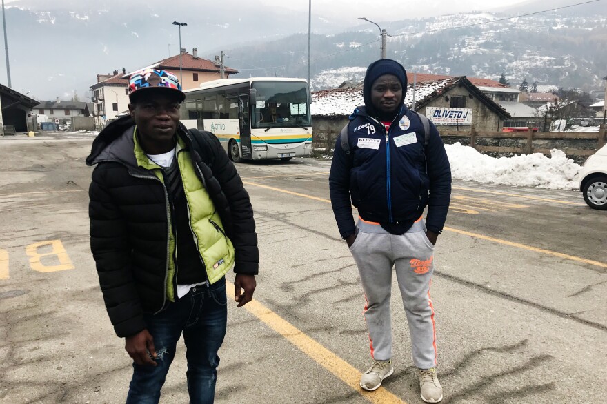 Harouna Waija (left) and Abdul Razak, both 22 and from Ghana, walk in the Italian Alps, near the French border.