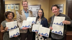 KUNC News took home eight journalism awards at the Top of the Rockies, given out by the Colorado chapter of the Society of Professional Journalists. Here, reporters Stephanie Daniel, Alex Hager, Rae Solomon, and Lucas Brady Woods (left to right) display the awards.