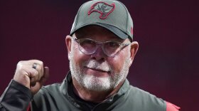 Tampa Bay Buccaneers coach Bruce Arians walks along the sideline before the team's NFL football game against the Atlanta Falcons on Dec. 5, 2021, in Atlanta. Arians has decided to retire as coach of the Buccaneers and move into a front-office role with the team, it was announced Wednesday night, March 30. Arians, who will turn 70 this coming season, coached the Bucs to the Super Bowl title in the 2020 season — Tom Brady’s first with Tampa Bay.