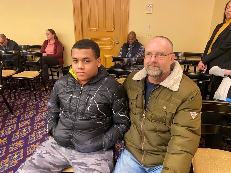  Christopher Brown and his father Chris Brown wait for the Ohio Redistricting Commission meeting to start on Sunday, March 27, 2022.