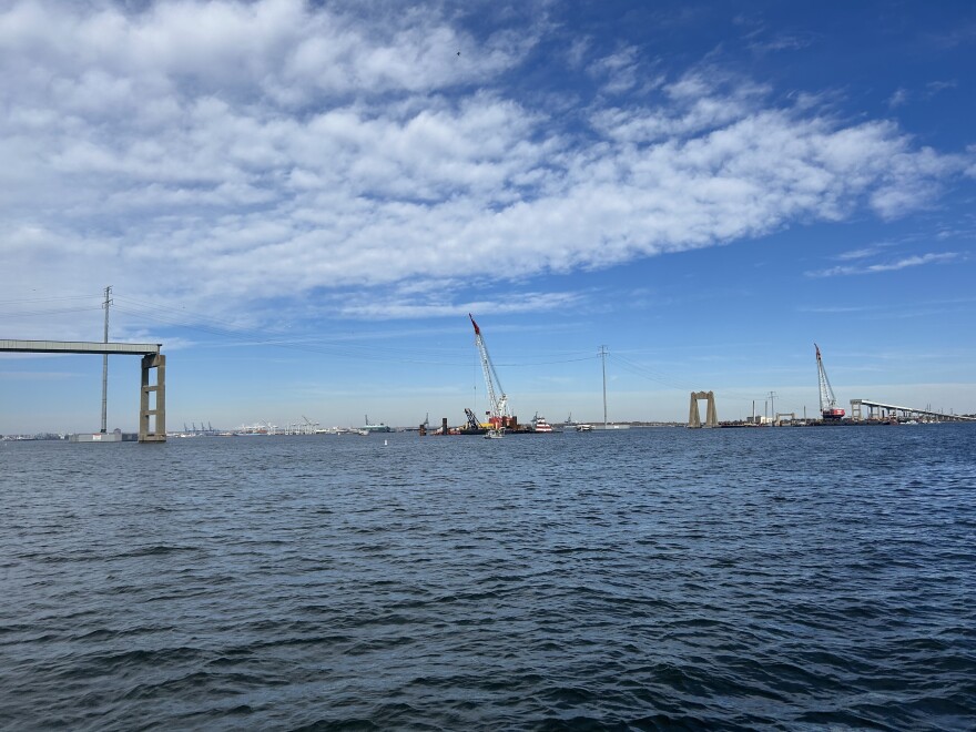 A crane helps put in test piles into the Patapsco River bed on November 5, 2025. The piles will hold up to 10 million pounds to ensure the soil is safe for the new Key Bridge.