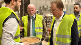 Jonathan Fife, the CEO of Bright Feeds, shows Gov. Ned Lamont and Rep. Joe Gresko, center, the animal feed his company makes from food waste.