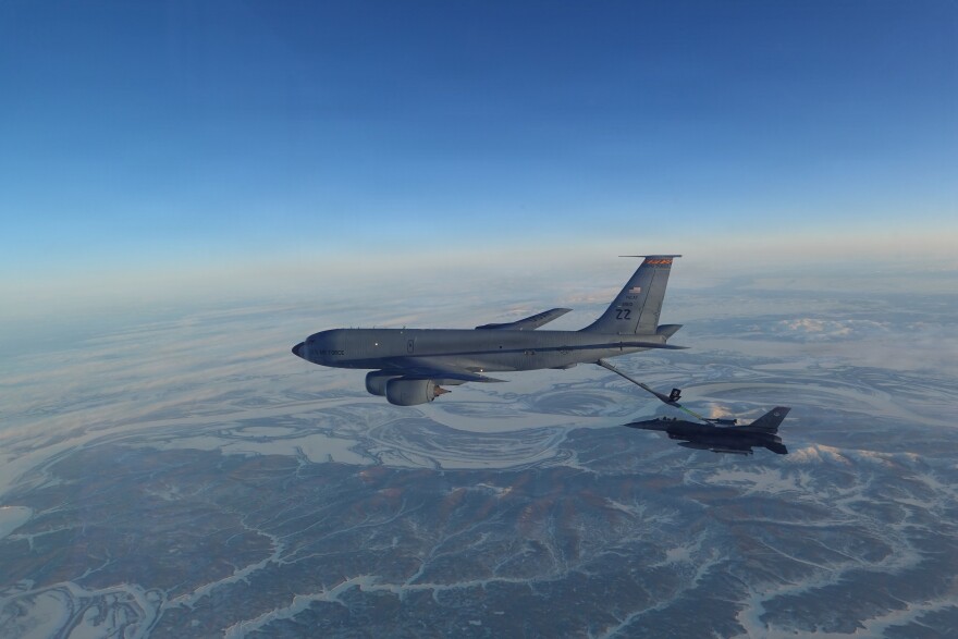 A KC-135 Stratotanker refuels an F-16 Fighting Falcon fighter jet over western Alaska Thursday while the aircraft were participating in an intercept of two formations of Russian military aircraft in and around the Bering Sea. The F-16 is assigned to the 18th Fighter Interceptor Squadron at Eielson Air Force Base.