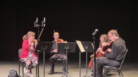 String quartet of violin, violin, viola and cello on stage
