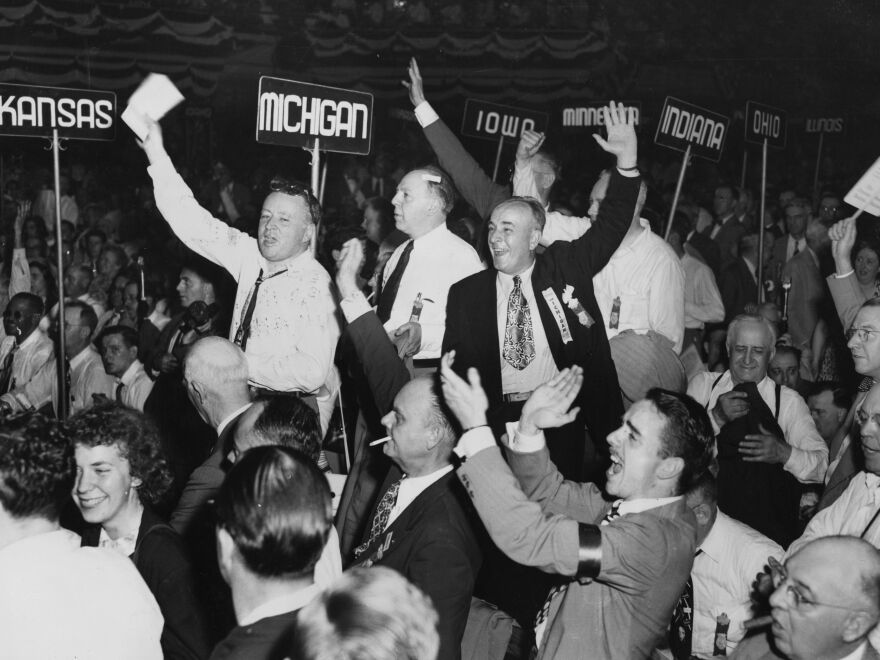Members of the Michigan delegation at the Republican National Convention in Philadelphia jump to their feet and cheer as Thomas Dewey's landslide victory as Republican nominee for president is announced.