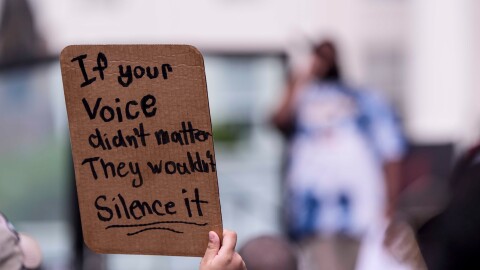 A sign at a voting rights rally on Saturday, May 16, 2026, in Montgomery, Alabama, reads "If your voice didn't matter, they wouldn't silence it."