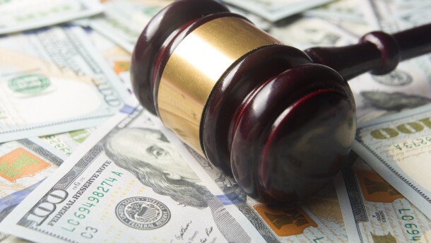 Gavel on a cash background 