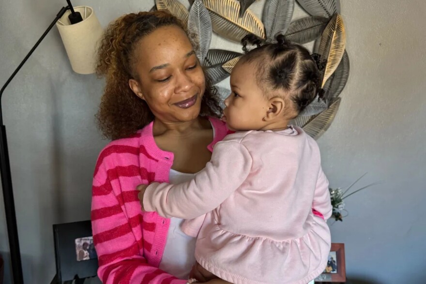 Matte’a Brooks takes care of her daughter inside their home in southern Illinois. Brooks signed up for Medicaid after finding out that her daughter was on the way.