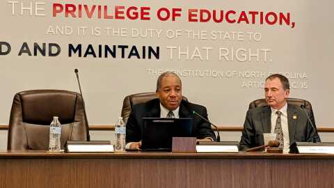 Mo Green (left) speaks at this week's state Board of Education meeting.
