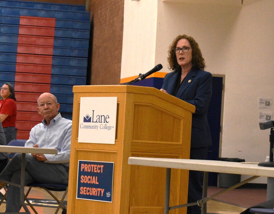 U.S Rep. Val Hoyle, D-Oregon, speaks at a town hall in Eugene on April 23, 2025, as former Rep. Peter DeFazio listens.