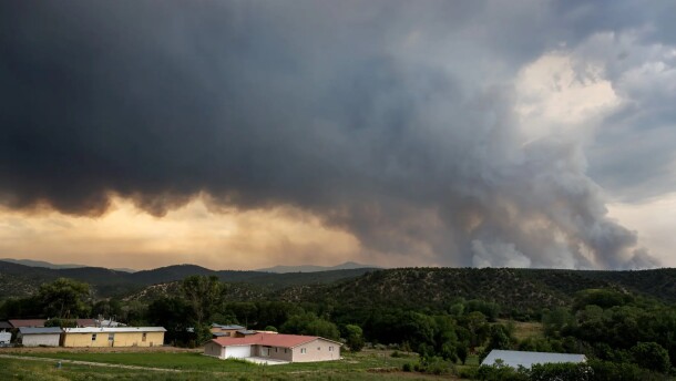 Smoke from the Frijoles Fire drifts over Cordova, located in Rio Arriba County, on Monday afternoon. Residents in one area within the village of Cundiyó were directed to leave their homes as the fire surpassed 4,000 acres.