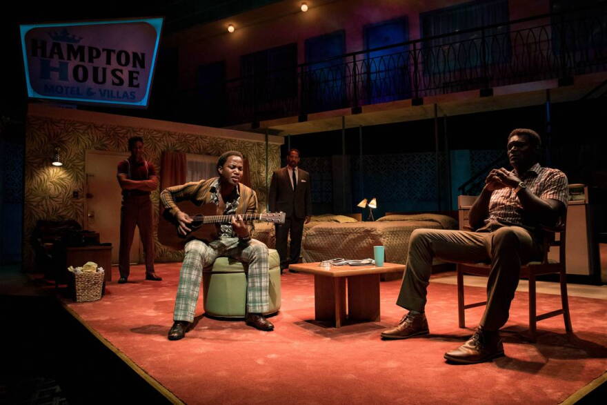 Kieron Anthony, Jason Delane and Esau Pritchett surround Leon Thomas, who plays Sam Cooke, as he sings "A Change Is Gonna Come" in "One Night in Miami."