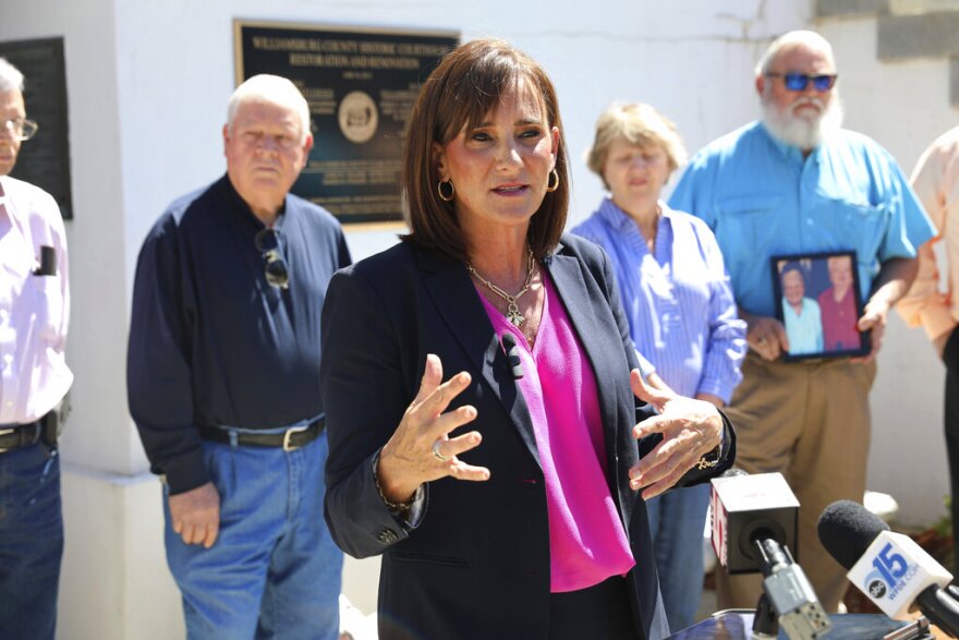 Attorney Lori Murray speaks at a news conference, Monday, May 9, 2022, in Kingstree, S.C. Murray asked prosecutors to release information about why the man charged in the killings of two sisters in October 2010 has been set free after being found incompetent to stand trial. (AP Photo/Jeffrey Collins)