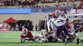 Indiana RB Turbo Richard getting tackled just after the first down marker.