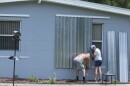 James Wolfe, 72, left, and Elaine Wolfe, 65, install shutters on their home in Vero Beach, Fla, Thursday, Aug. 29, 2019. The U.S. National Hurricane Center says Dorian could hit the Florida coast over the weekend as a major hurricane.