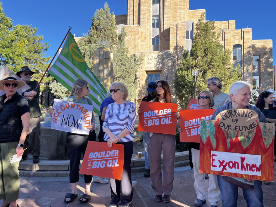 Penny Seguin (center) was among those gathered outside of the Boulder County Courthouse while the Supreme Court heard oral arguments in Washington, D.C.