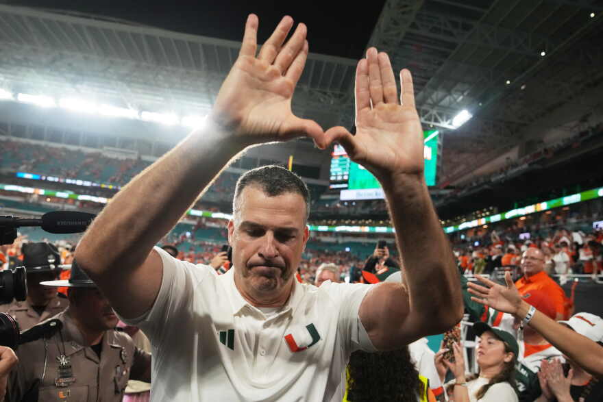 Miami head coach Mario Cristobal celebrates after Miami defeated Florida State in double overtime of an NCAA college football game, Saturday, Oct. 17, 2026, in Miami Gardens, Fla. (AP Photo/Lynne Sladky)