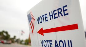 Vote here sign in front of a caucus site.