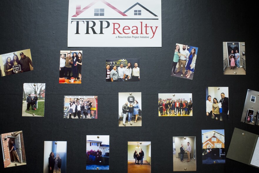 Photos of people closing on homes with TRP Realty, the Resurrection Project's in-house realty group, as part of the Full Circle Homes Initiative, pictured on Nov. 6, 2017, in Chicago. (Michelle Kanaar for Here & Now)