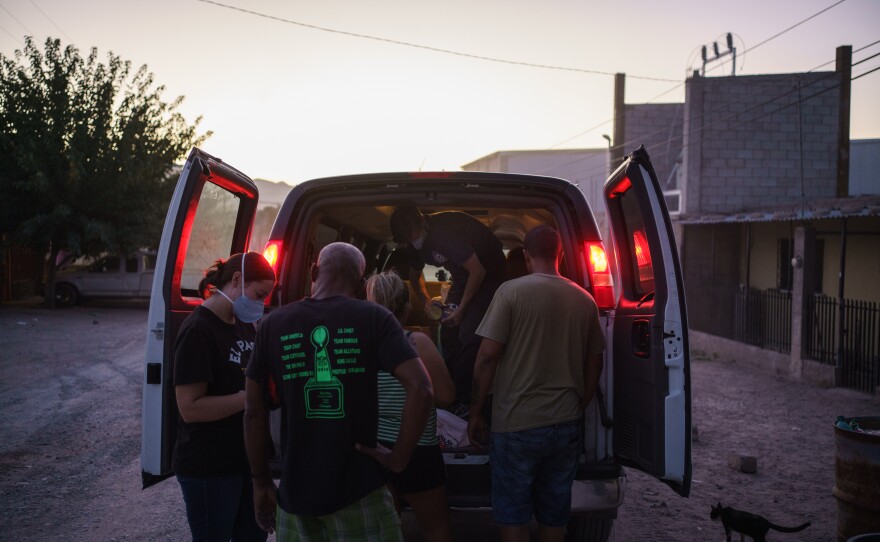 Lindy Morrison and Will Rocci make a food delivery to Cubans in Ciudad Jurez on September 24, 2020 at dusk.