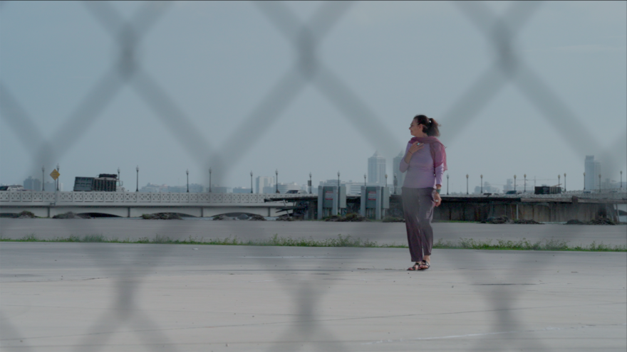 Maggie Steber, former Asst. Managing Editor of Photography and Features at The Miami Herald, stands at the site where One Herald Plaze used to be as part of filming for the documentary News Without a Newsroom.