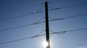 FILE - Vermont Electric Power Company transmission lines are seen on Feb. 8, 2012, in Waterbury, Vt. A New Hampshire electric utility is offering a new proposal for an electrical transmission line from Canada that would carry renewable power to New England. The proposed 211-mile, $2 billion Twin State Clean Energy Link would enter the United States in Canaan, Vt. (AP Photo/Toby Talbot, File)