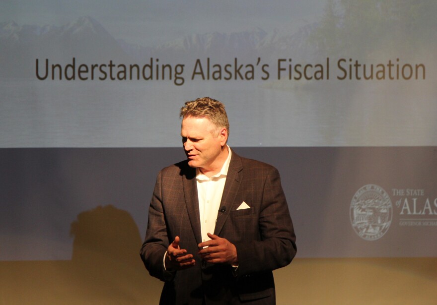 Governor Mike Dunleavy speaks with a constituent ahead of a presentation at a policy forum organized by Americans for Prosperity's Alaska chapter (Photo: Zachariah Hughes - Alaska Public Media, Anchorage)