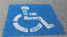 A handicap parking sign on a parking space