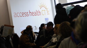 People wait to sign up for health coverage at Access Health CT.