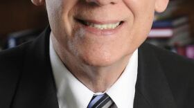 Close up of man looking into camera.