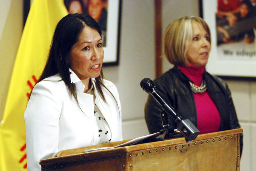 FILE - Lynn Trujillo, of Sandia Pueblo, left, speaks at a news conference in Santa Fe, N.M., on Jan. 22, 2019. Trujillo, a Native American attorney who oversaw New Mexico's Indian Affairs Department, has been tapped to serve as a top legal advisor to U.S. Interior Department Secretary Deb Haaland. The Interior Department announced the appointment of Trujillo as senior counsel to the secretary Friday, Feb. 10, 2023. Trujillo worked as a state Cabinet secretary for nearly four years under Democratic New Mexico Gov. Michelle Lujan Grisham as a crucial liaison with Native American communities during the upheaval of the COVID-19 pandemic. (AP Photo/Morgan Lee, File)