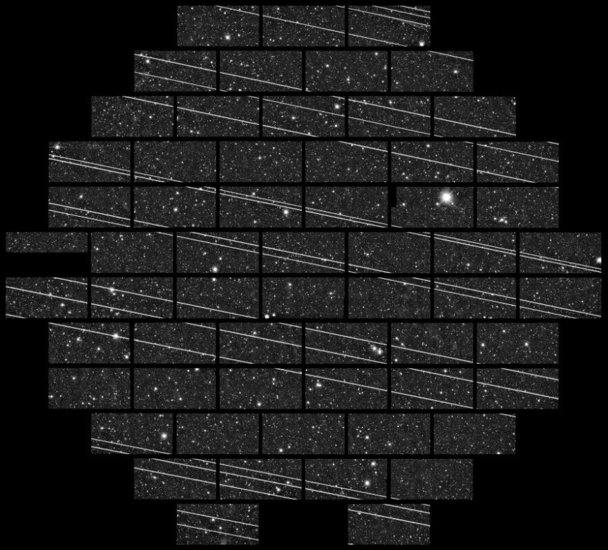 An image from the Cerro Tololo Inter-American Observatory showing at least 19 streaks that astronomers quickly surmised were Starlink satellites.