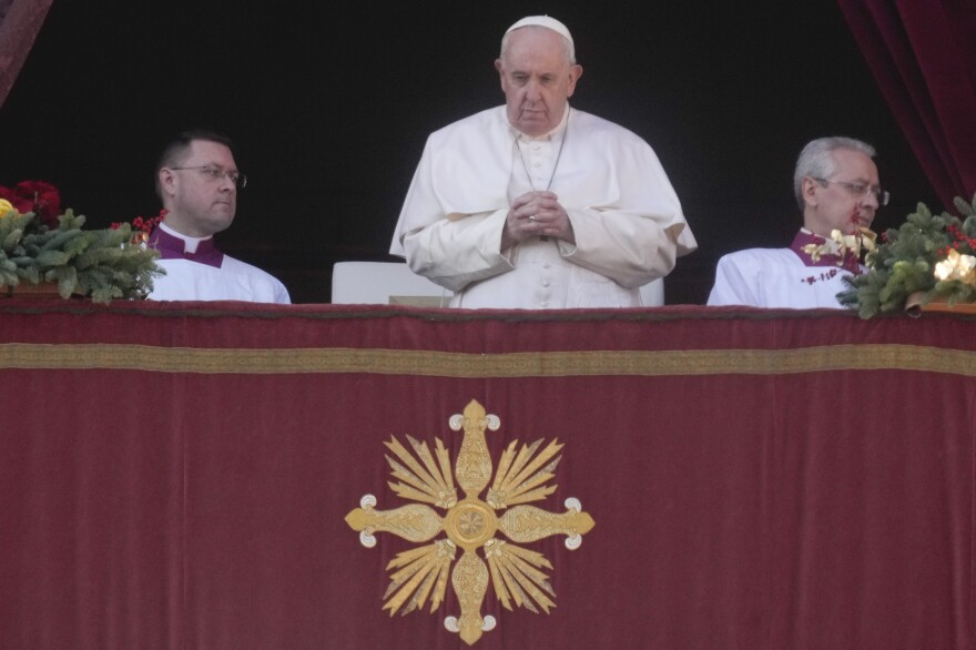 Pope Francis delivers the Urbi et Orbi (Latin for 'to the city and to the world') Christmas day blessing from the main balcony of St. Peter's Basilica at the Vatican on Sunday.