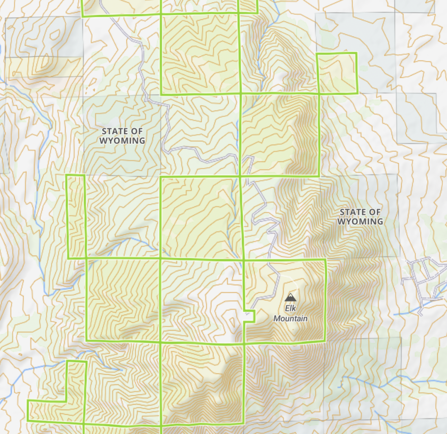 The intermingling parcels on Elk Mountain. Highlighted regions are federal, state parcels are marked and blank spots are private.