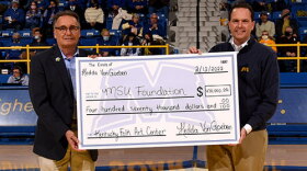 Photo, right (left to right): Rick Hesterberg, vice president for University Advancement, and MSU President Dr. Jay Morgan recognized the estate gift of Hedda von Goeben at the MSU Eagle basketball games on Saturday, Feb. 12.