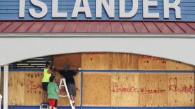 Workers cover a business with plywood in preparation for Hurricane Harvey, Thursday, Aug. 24, 2017, in Corpus Christi, Texas. (Eric Gay/AP)