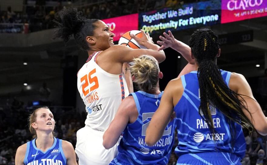 Connecticut Sun's Alyssa Thomas (25) shoots as Chicago Sky's Courtney Vandersloot (22) and Candace Parker defend during the first half of Game 5 in a WNBA basketball playoffs semifinal Thursday, Sept. 8, 2022, in Chicago.