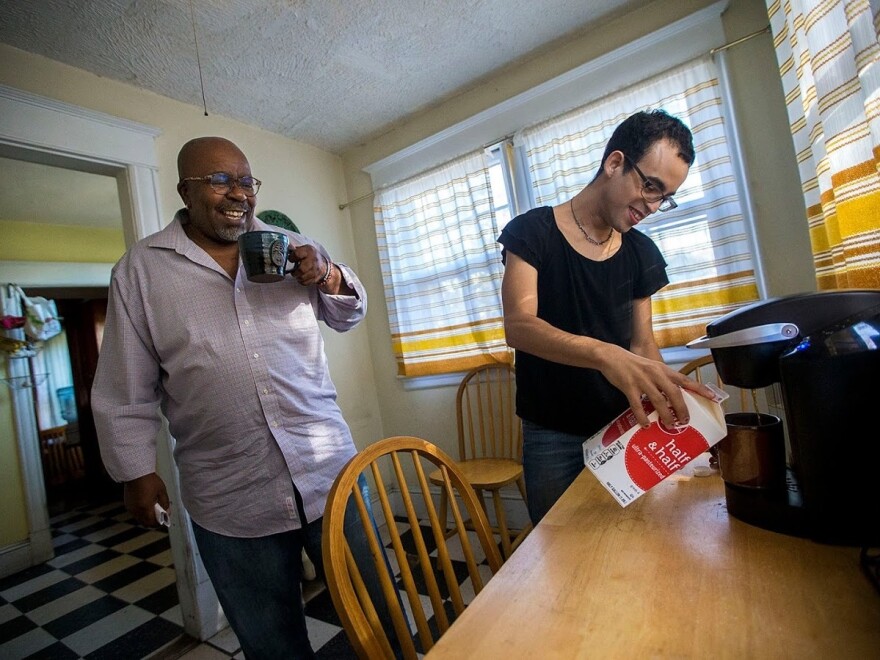 Louis Mitchell and Rivera have coffee together in the kitchen of their house in Springfield, Mass. Many days, to avoid threats and stares, Rivera does not leave the house.