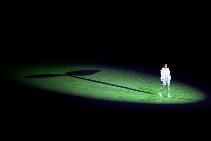 A performer is seen acting during the Opening Ceremony.